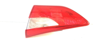 Trunk lid tail light and its parts