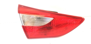 Trunk lid tail light and its parts