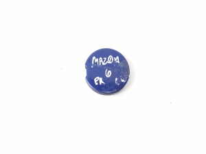 Cache crochet de remorquage de pare-chocs avant - GJ6A50A11